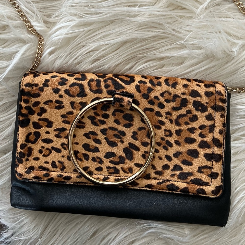 Brand new Aldo animal print clutch with removable strap